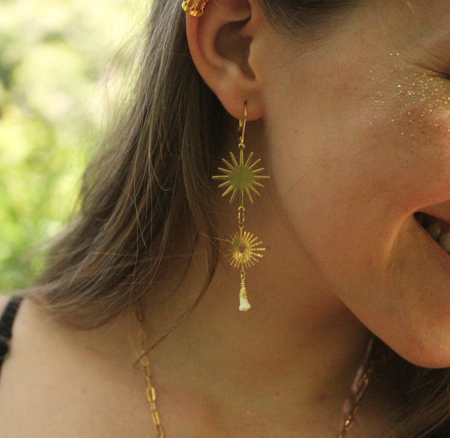 Sunburst Eye Raccoon Teeth Earrings